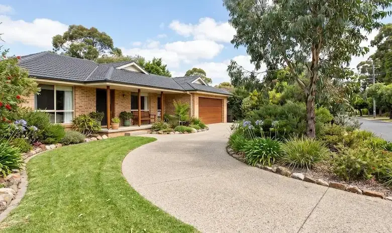 Exposed aggregate concrete driveway with standard residential driveway thickness in Perth WA