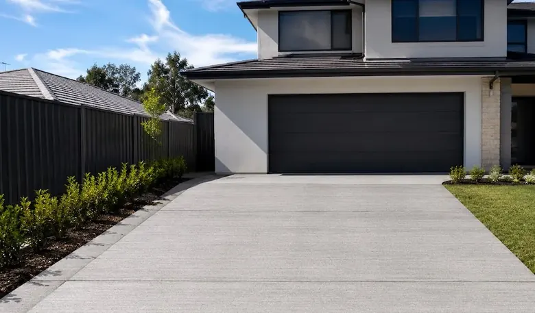 Broom-finished concrete driveway at modern Perth two-storey home