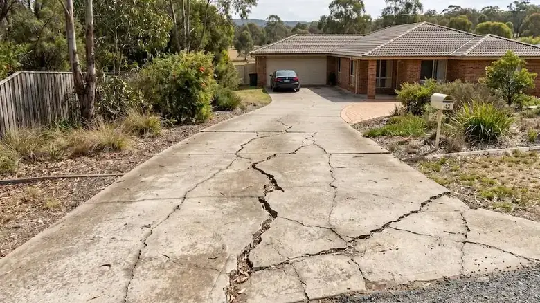 Severely cracked concrete driveway in Perth WA showing major structural driveway crack repair issues
