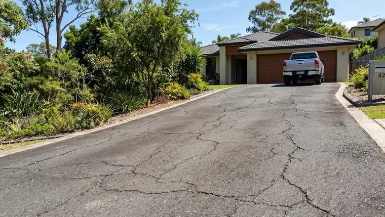 Cracked residential driveway showing surface wear and maintenance issues in Perth WA