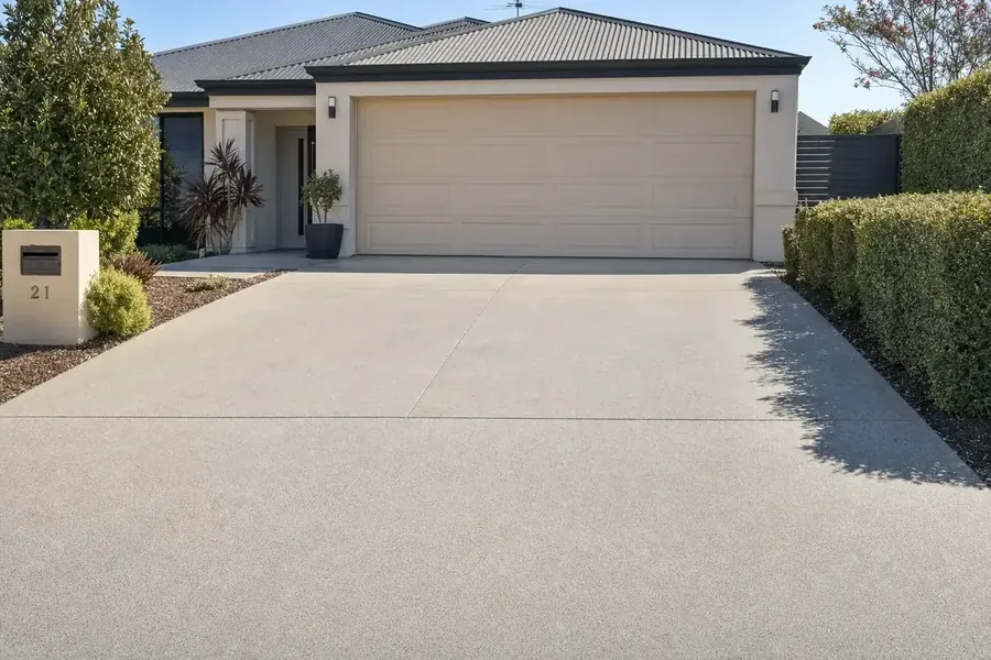 Repaired concrete driveway in front of a Perth home