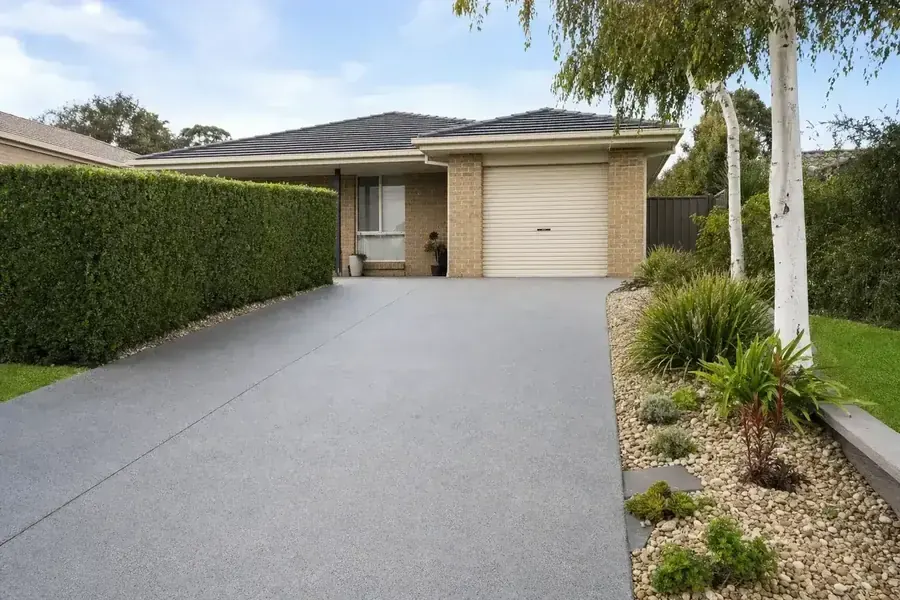 Resurfacing and finishing a concrete driveway at a Perth home